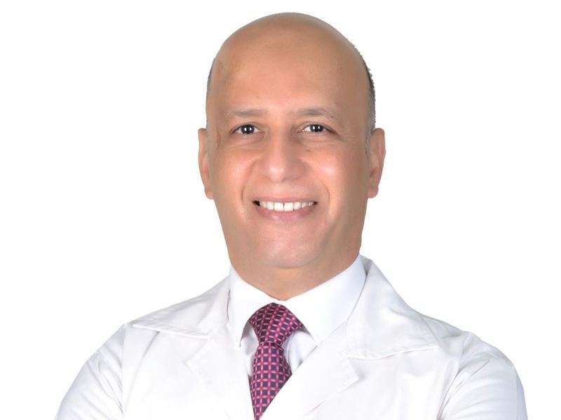 Dr. Mohamed Hussein in a white coat